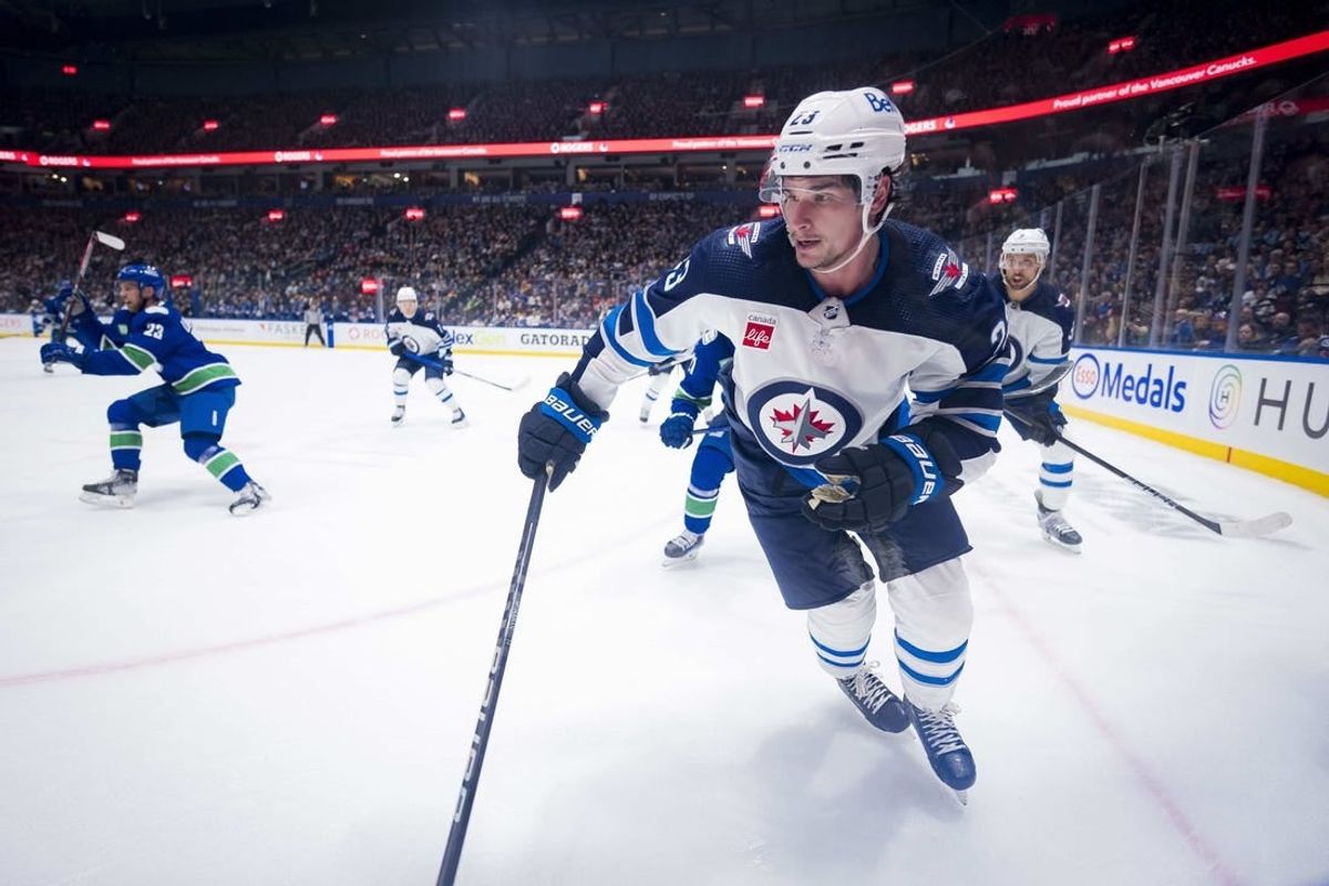 Feb 17, 2024; Vancouver, British Columbia, CAN; Winnipeg Jets forward Sean Monahan (23) skates against the Vancouver Canucks in the second period at Rogers Arena.