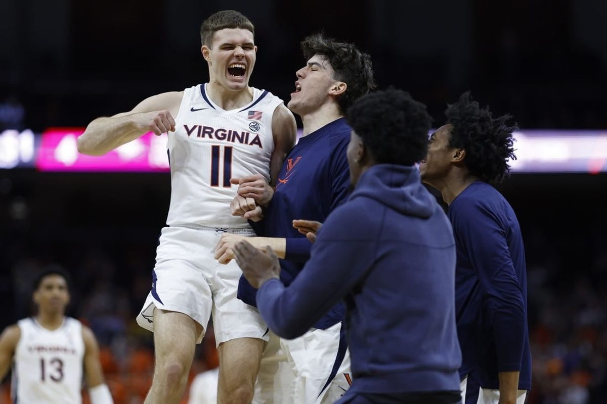 Dec 5, 2023; Charlottesville, Virginia, USA; Virginia Cavaliers guard Isaac McKneely (11) celebrates with teammates against the North Carolina Central Eagles in the first half at John Paul Jones Arena.