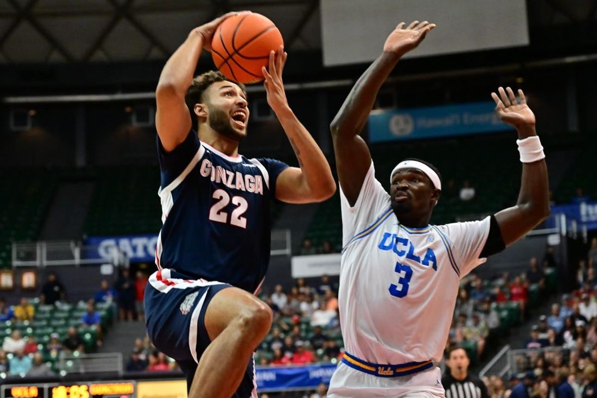 Nov 22, 2023; Honolulu, HI, USA; sGonzaga Bulldogs forward Anton Watson (22) shoots the ball defended by UCLA Bruins forward Adem Bona (3) during the first period at SimpliFi Arena at Stan Sheriff Center.
