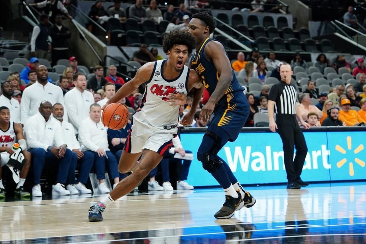 Dec 16, 2023; San Antonio, Texas, USA; Mississippi Rebels forward Jaemyn Brakefield (4) dribbles against California Golden Bears guard Jalen Celestine (32) in the second half at the Frost Bank Center.