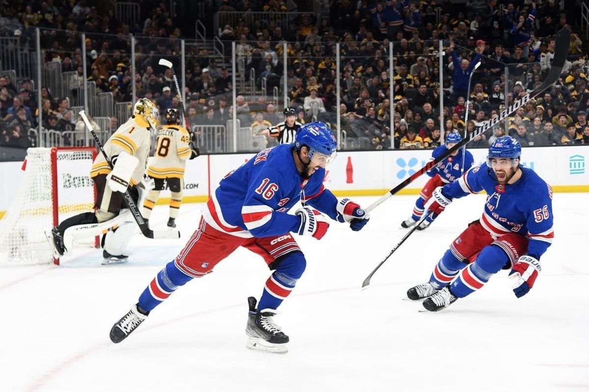Dec 16, 2023; Boston, Massachusetts, USA;  New York Rangers defenseman Erik Gustafsson (56) reacts on an overtime goal by center Vincent Trocheck (16) against the Boston Bruins at TD Garden.