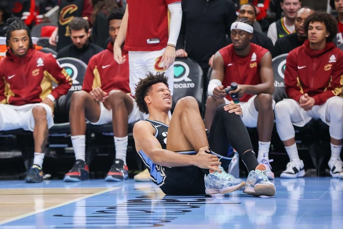 Mar 6, 2024; Atlanta, Georgia, USA; Atlanta Hawks forward Jalen Johnson (1) reacts after an ankle injury against the Cleveland Cavaliers in the second half at State Farm Arena.
