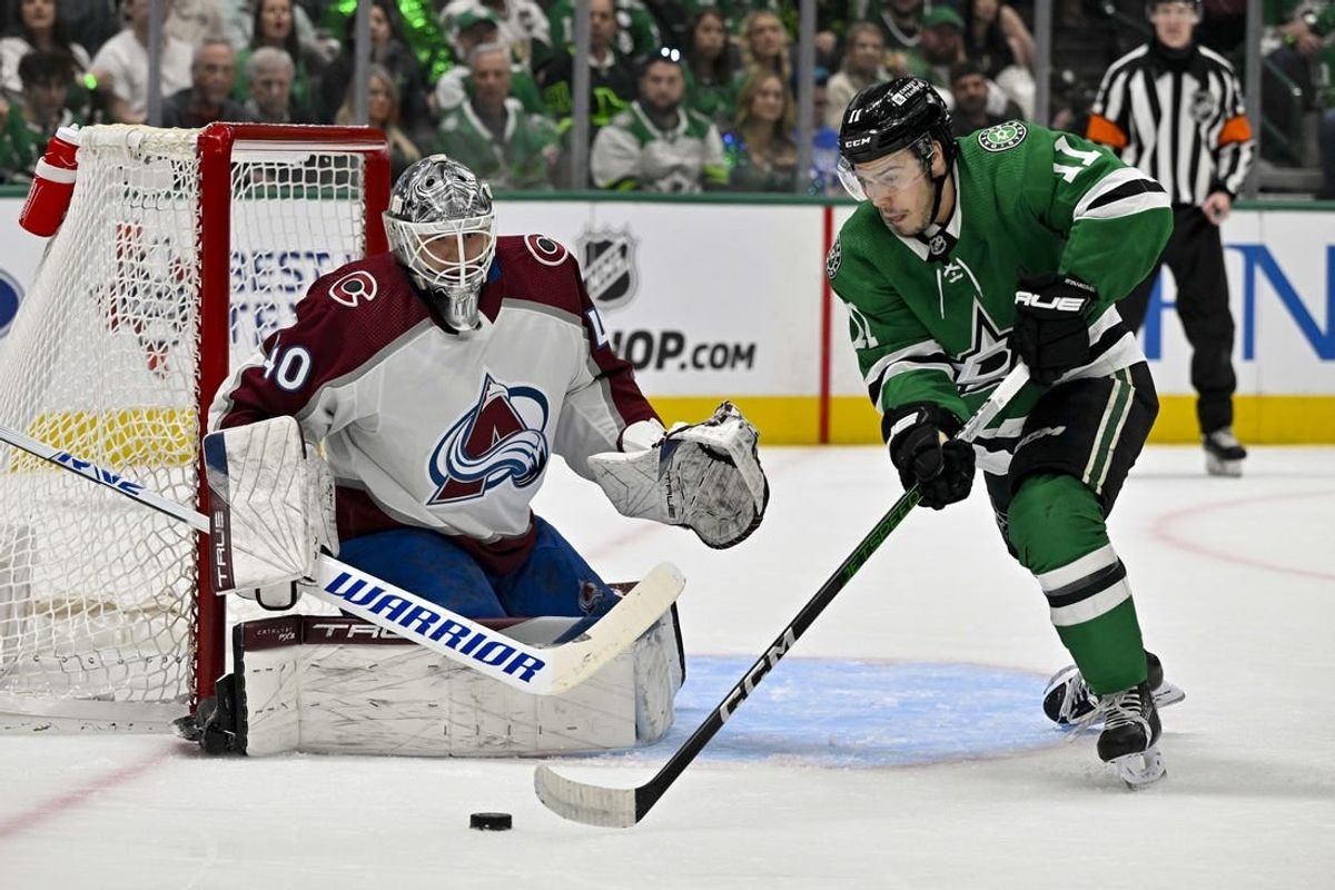 May 7, 2024; Dallas, Texas, USA; Dallas Stars center Logan Stankoven (11) looks to poke the puck past Colorado Avalanche goaltender Alexandar Georgiev (40) during the second period in game one of the second round of the 2024 Stanley Cup Playoffs at American Airlines Center.