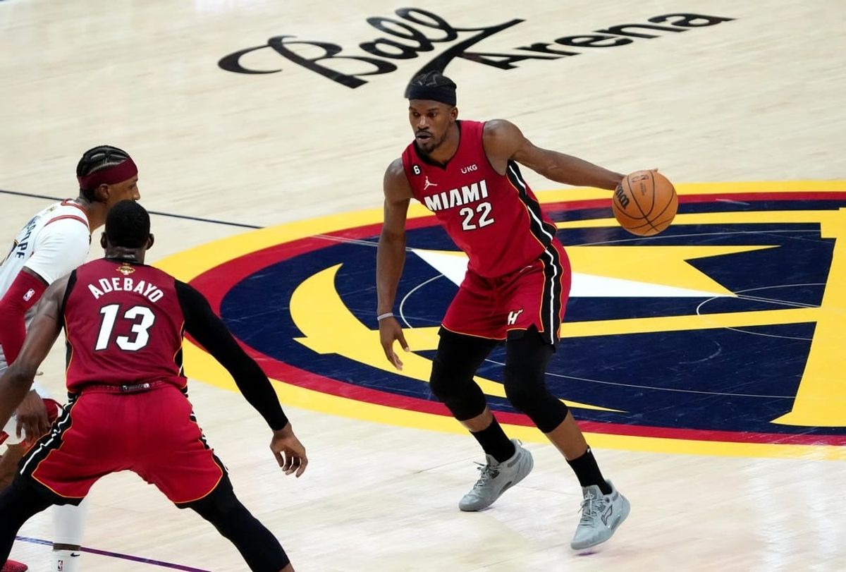 Jun 12, 2023; Denver, Colorado, USA; Miami Heat forward Jimmy Butler (22) dribbles during the fourth quarter of game five of the 2023 NBA Finals against the Denver Nuggets at Ball Arena.