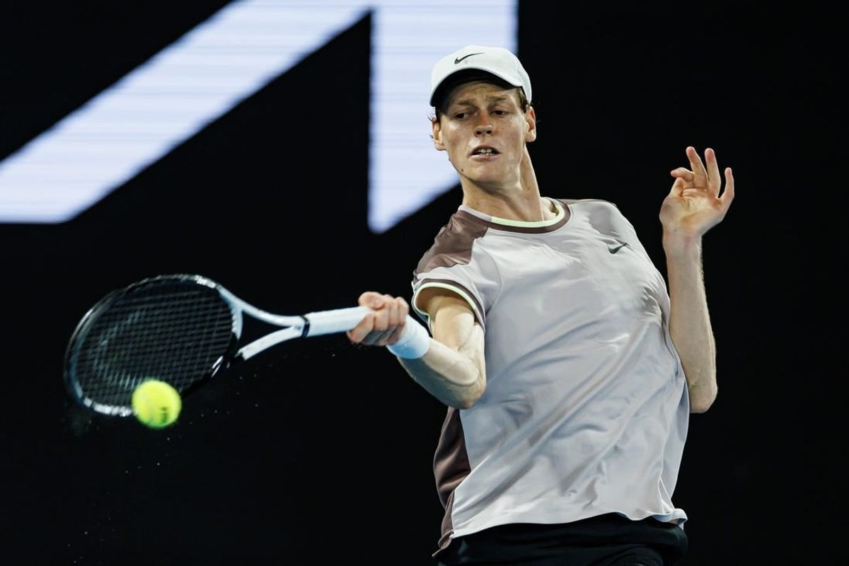 Jan 23, 2024; Melbourne, Victoria, Australia;  Jannik Sinner of Italy in action against Andrey Rublev of Russia in the quarter final of the men s singles.