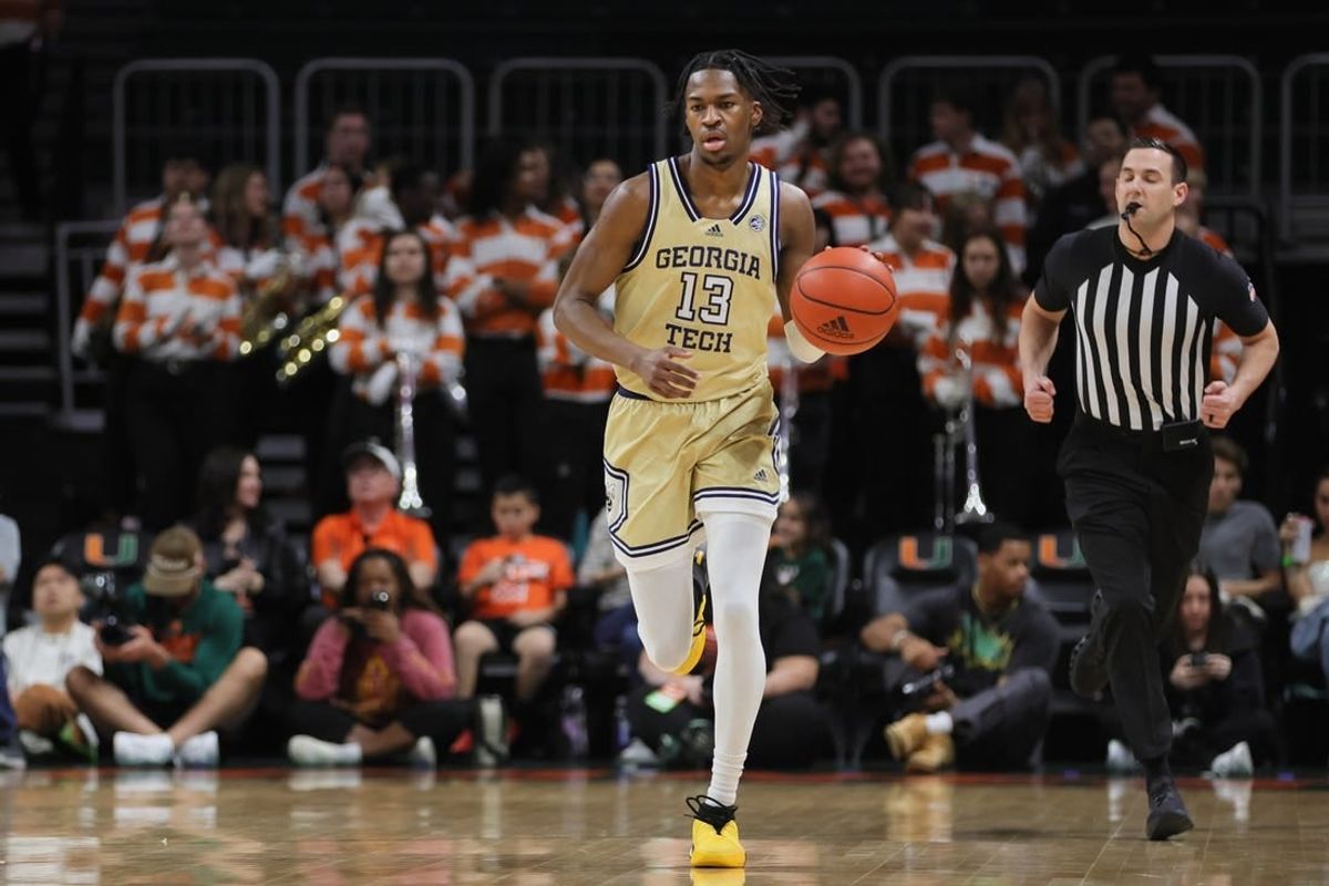 Feb 24, 2024; Coral Gables, Florida, USA; Georgia Tech Yellow Jackets guard Miles Kelly (13) dribbles the basketball against the Miami Hurricanes during the first half at Watsco Center.