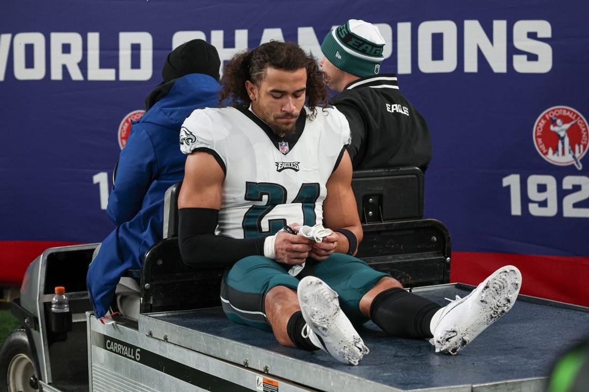 Jan 7, 2024; East Rutherford, New Jersey, USA; Philadelphia Eagles safety Sydney Brown (21) is carted off the field after an injury during the first half against the New York Giants at MetLife Stadium.