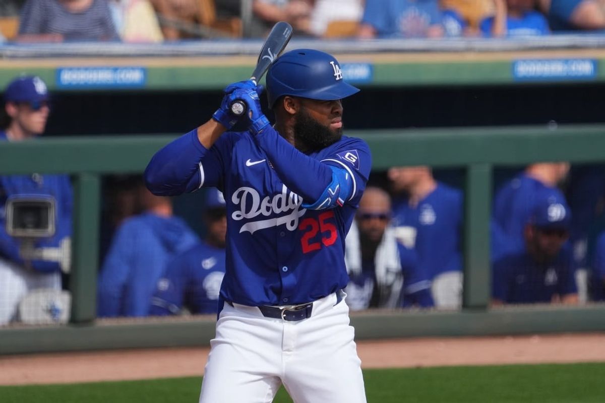 Feb 25, 2024; Phoenix, Arizona, USA; Los Angeles Dodgers designated hitter Manuel Margot (25) bats against the Oakland Athletics during the third inning at Camelback Ranch-Glendale.