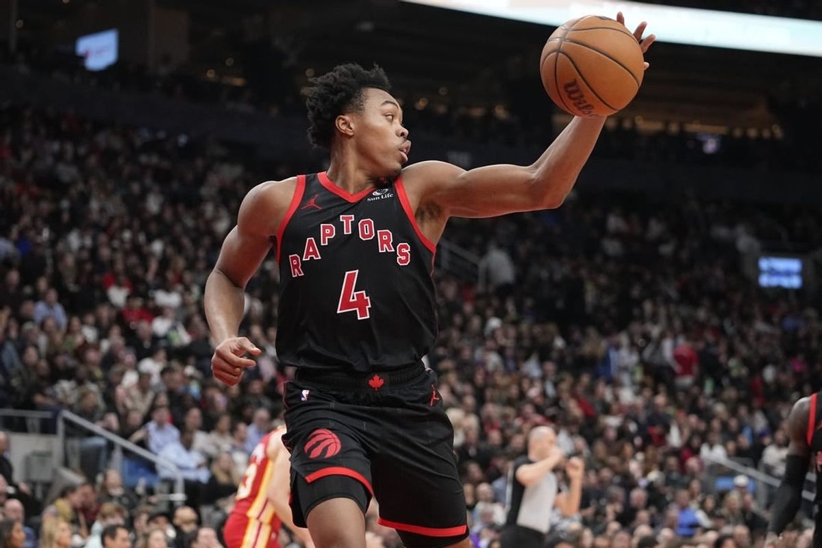 Dec 15, 2023; Toronto, Ontario, CAN; Toronto Raptors forward Scottie Barnes (4) grabs a rebound against the Atlanta Hawks during the first half at Scotiabank Arena.