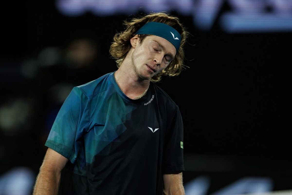 Jan 23, 2024; Melbourne, Victoria, Australia;  Andrey Rublev of Russia reacts during his match against Jannik Sinner of Italy in the quarter final of the men s singles.