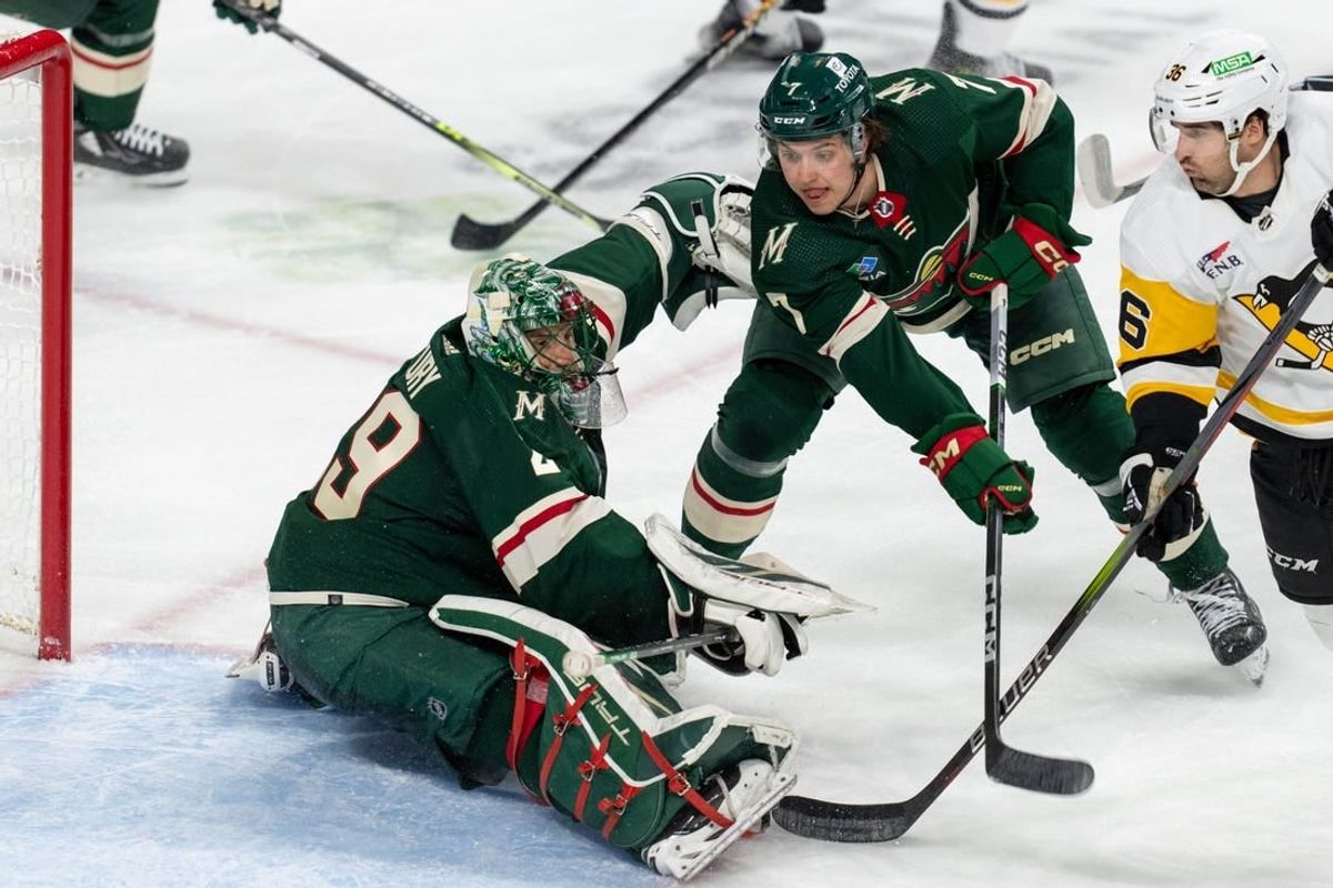 Feb 9, 2024; Saint Paul, Minnesota, USA; Minnesota Wild goaltender Marc-Andre Fleury (29) makes a save as Pittsburgh Penguins center Colin White (36) looks for a rebound in the second period at Xcel Energy Center.