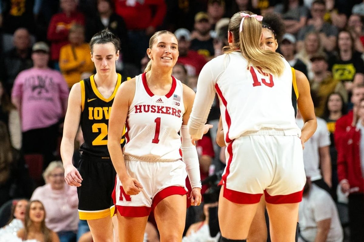 Feb 11, 2024; Lincoln, Nebraska, USA; Nebraska Cornhuskers guard Jaz Shelley (1) celebrates after making a three point shot against Iowa Hawkeyes guard Caitlin Clark (22) during the fourth quarter at Pinnacle Bank Arena.