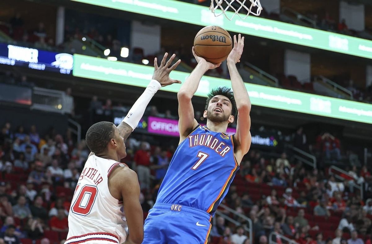 Feb 25, 2024; Houston, Texas, USA; Oklahoma City Thunder forward Chet Holmgren (7) shoots the ball as Houston Rockets forward Jabari Smith Jr. (10) defends during the third quarter at Toyota Center.