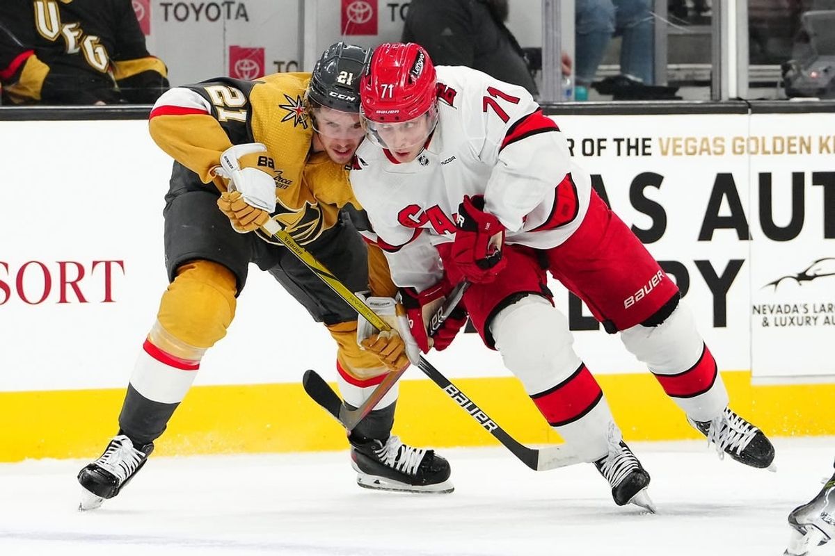 Feb 17, 2024; Las Vegas, Nevada, USA; Vegas Golden Knights center Brett Howden (21) skates against Carolina Hurricanes right wing Jesper Fast (71) during the first period at T-Mobile Arena.