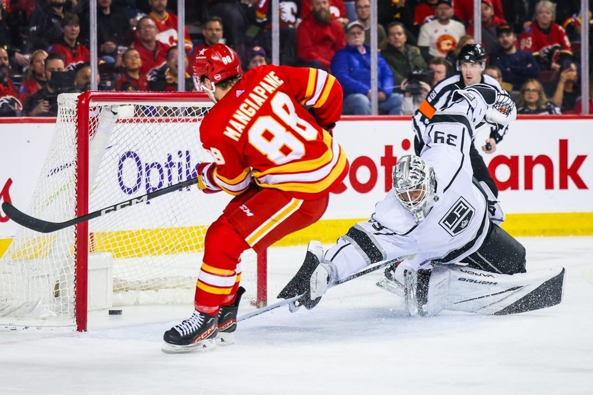 Feb 27, 2024; Calgary, Alberta, CAN; Calgary Flames left wing Andrew Mangiapane (88) scores a goal against Los Angeles Kings goaltender Cam Talbot (39) during the second period at Scotiabank Saddledome.