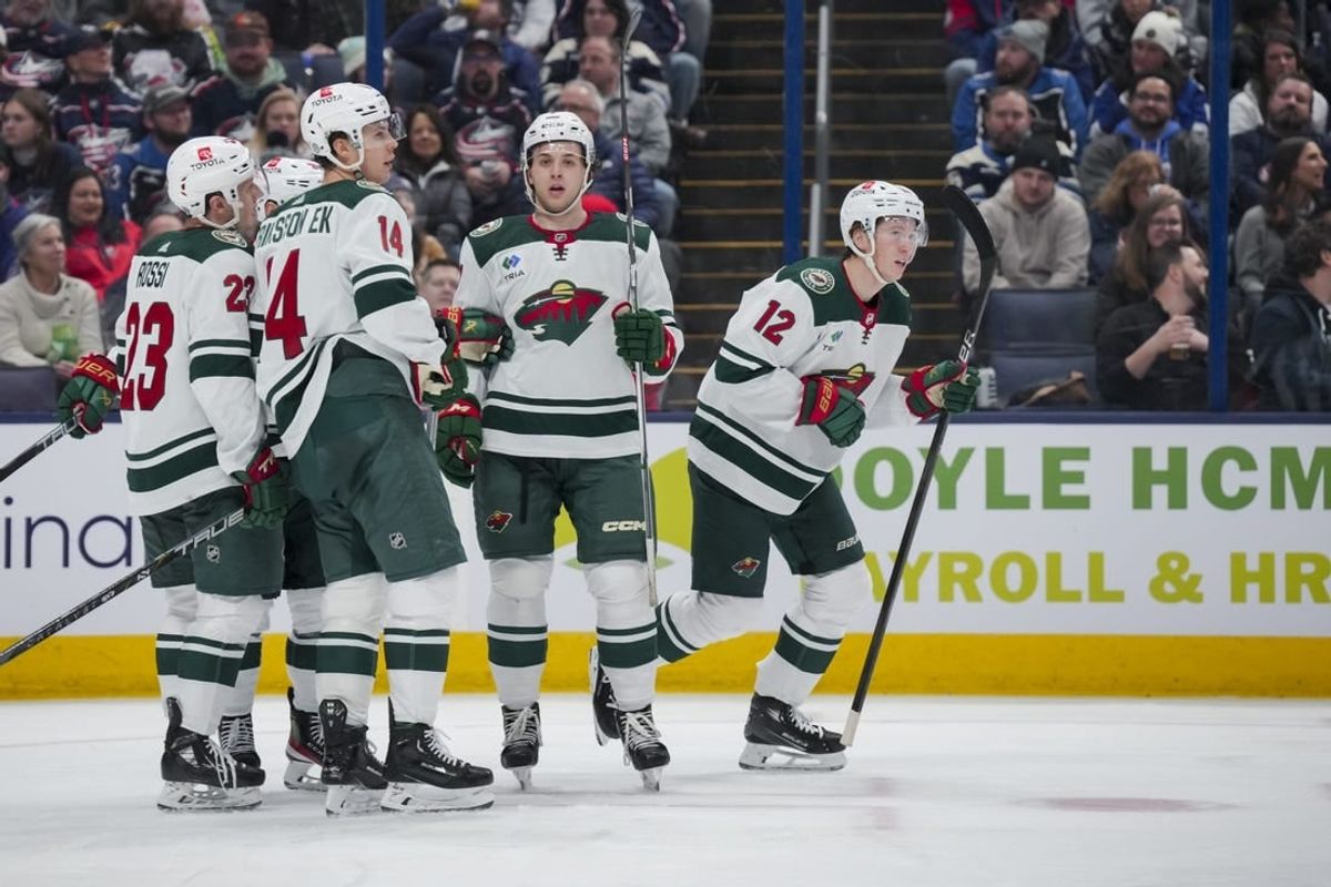 Jan 6, 2024; Columbus, Ohio, USA;  Minnesota Wild left wing Matt Boldy (12) celebrates with teammates after scoring a goal against the Columbus Blue Jackets in the second period at Nationwide Arena.