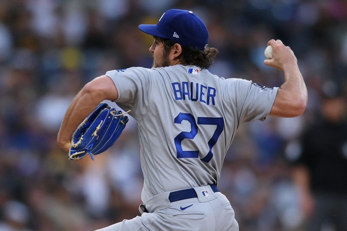 Jun 23, 2021; San Diego, California, USA; Los Angeles Dodgers starting pitcher Trevor Bauer (27) throws a pitch against the San Diego Padres during the first inning at Petco Park.