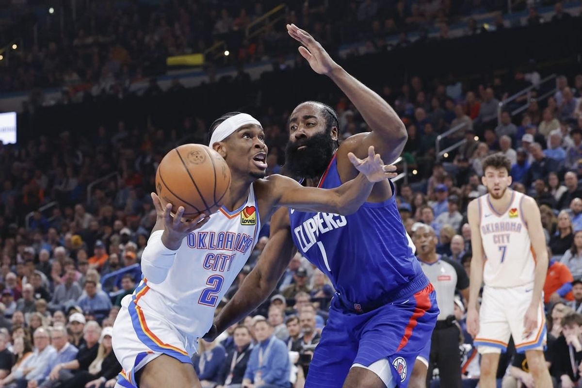 Feb 22, 2024; Oklahoma City, Oklahoma, USA; Oklahoma City Thunder guard Shai Gilgeous-Alexander (2) moves to the basket beside LA Clippers guard James Harden (1) during the second quarter at Paycom Center.