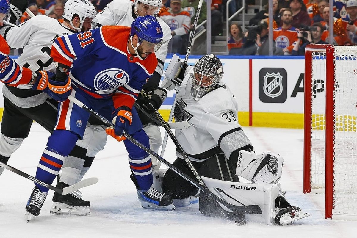 Apr 22, 2024; Edmonton, Alberta, CAN; Edmonton Oilers forward Evander Kane (91) tries to knock a rebound past Los Angeles Kings goaltender Cam Talbot (39) during the first period in game one of the first round of the 2024 Stanley Cup Playoffs at Rogers Place.