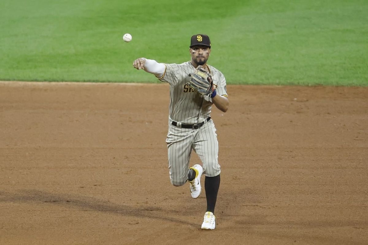 Sep 30, 2023; Chicago, Illinois, USA; San Diego Padres shortstop Xander Bogaerts (2) throws to first base for a Chicago White Sox out during the ninth inning at Guaranteed Rate Field.