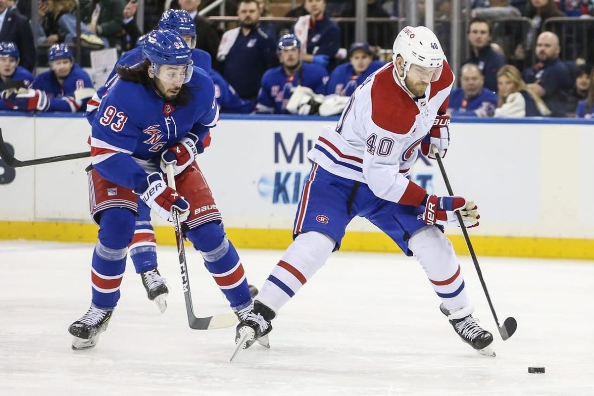 Feb 15, 2024; New York, New York, USA; Montreal Canadiens right wing Joel Armia (40) skates past New York Rangers center Mika Zibanejad (93) on a breakaway in the first period at Madison Square Garden.