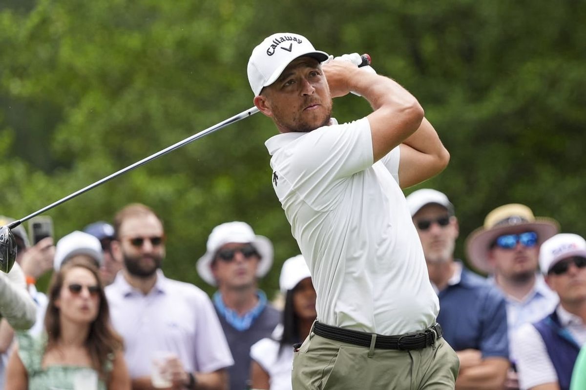May 10, 2024; Charlotte, North Carolina, USA; Xander Schauffele plays his shot from the third tee during the second round of the Wells Fargo Championship golf tournament.