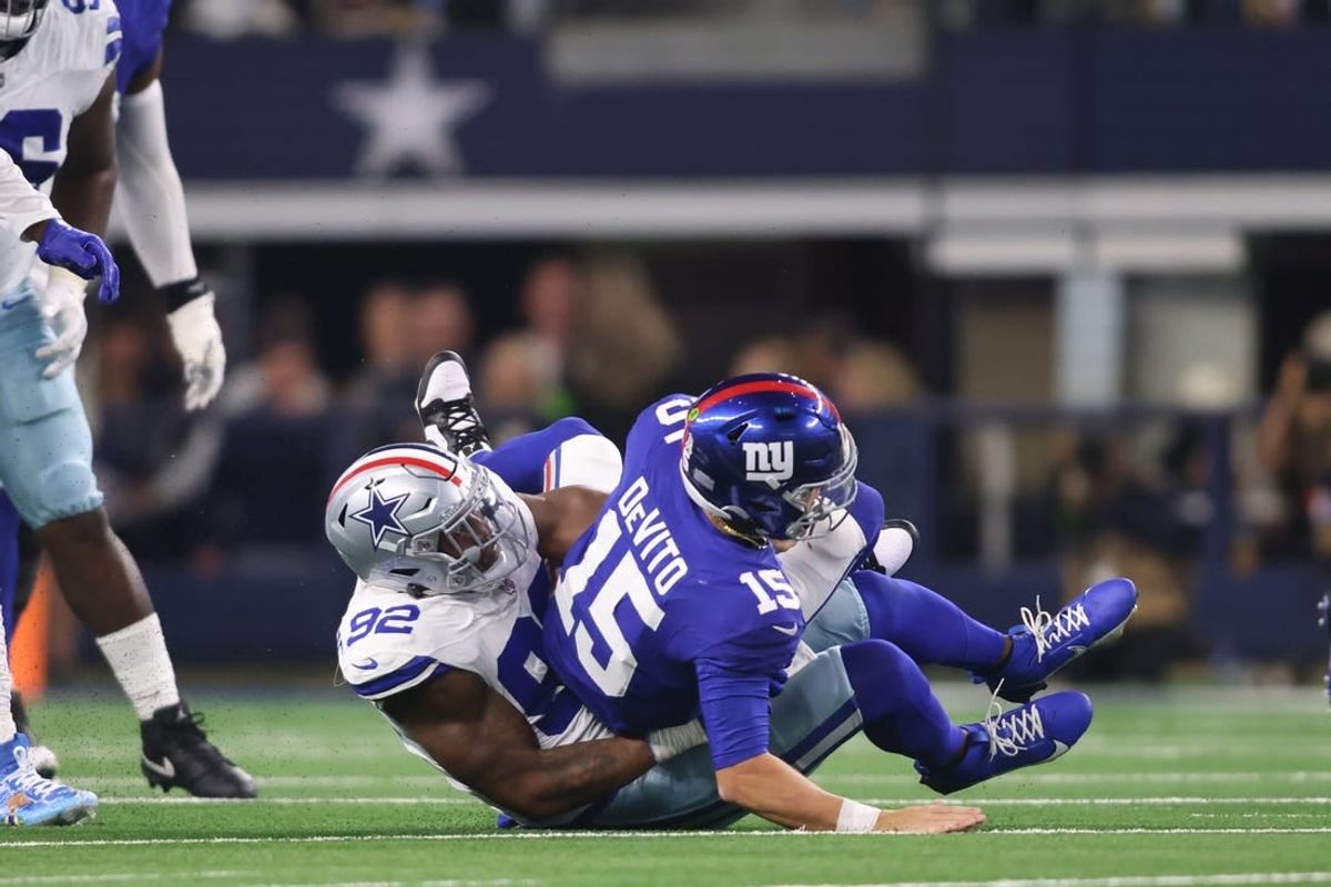 Nov 12, 2023; Arlington, Texas, USA; Dallas Cowboys defensive end Dorance Armstrong (92) sacks New York Giants quarterback Tommy DeVito (15) in the second half at AT&T Stadium.