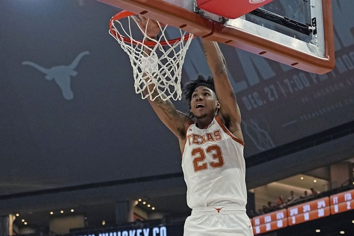 Dec 9, 2023; Austin, Texas, USA; Texas Longhorns forward Dillon Mitchell (23) dunks during the first half against the Houston Christian Huskies at Moody Center.
