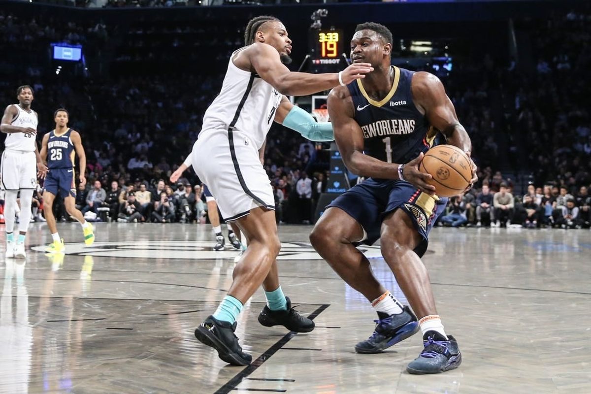 Mar 19, 2024; Brooklyn, New York, USA;  New Orleans Pelicans forward Zion Williamson (1) looks to drive past Brooklyn Nets guard Dennis Smith Jr. (4) in the second quarter at Barclays Center.