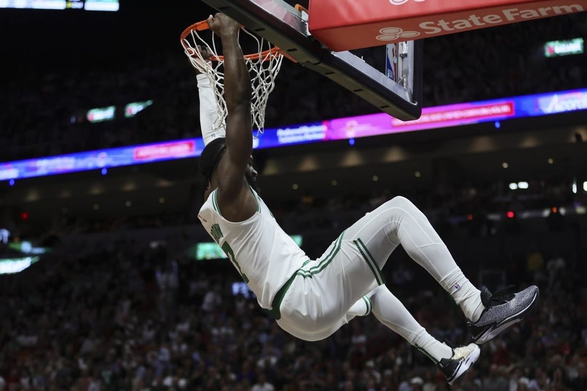 Jan 25, 2024; Miami, Florida, USA; Boston Celtics guard Jaylen Brown (7) dunks the basketball against the Miami Heat during the second quarter at Kaseya Center.