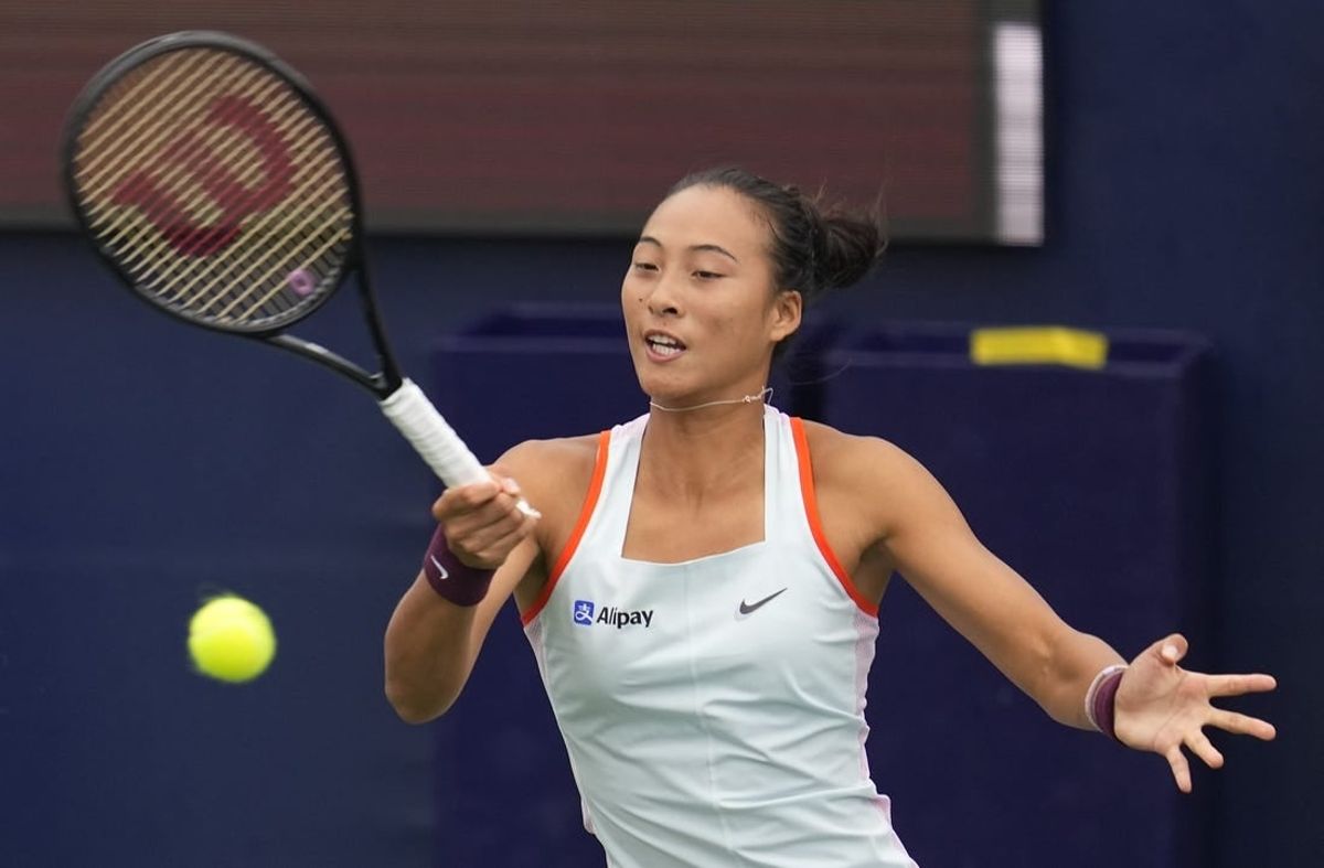 Oct 13, 2022; San Diego, California, US;  Qinwen Zheng of China hits the ball against Iga Swiatek of Poland during the San Diego Open at Barnes Tennis Center.