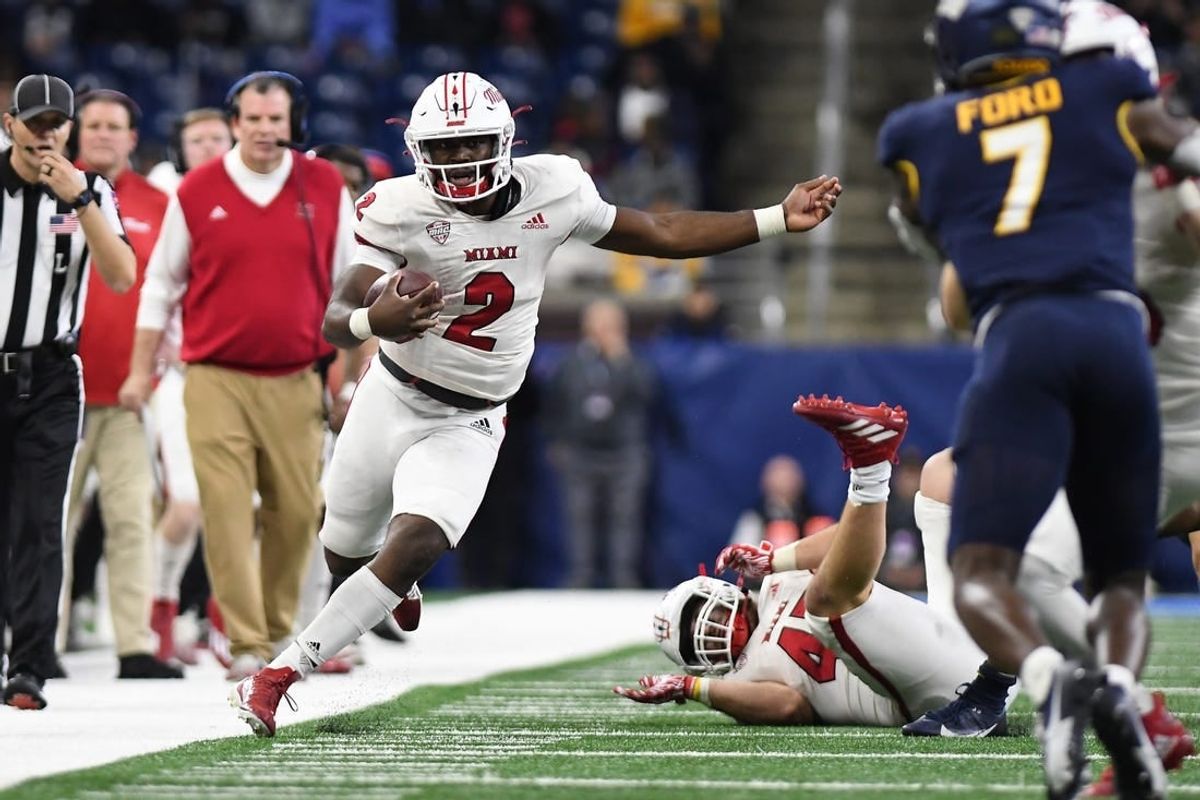 Dec 2, 2023; Detroit, MI, USA; Miami (OH) Redhawks quarterback Aveon Smith (2) runs up the sidelines against the Toledo Rockets in the third quarter at Ford Field.