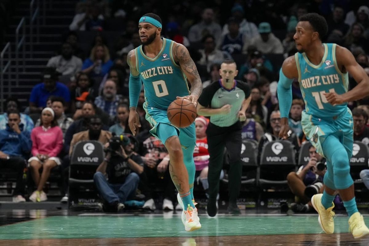 Dec 16, 2023; Charlotte, North Carolina, USA; Charlotte Hornets forward Miles Bridges (0) brings the ball up court against the Philadelphia 76ers during the second half at Spectrum Center.