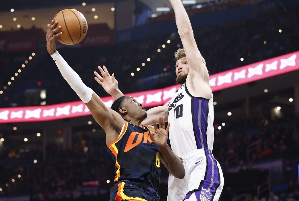 Feb 11, 2024; Oklahoma City, Oklahoma, USA; Oklahoma City Thunder forward Jalen Williams (8) shoots as Sacramento Kings forward Domantas Sabonis (10) defends during the second half at Paycom Center.