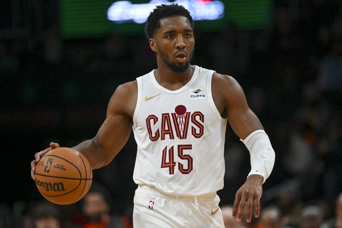 Feb 25, 2024; Washington, District of Columbia, USA;  Cleveland Cavaliers guard Donovan Mitchell (45) dribbles up the court during the first half against the Washington Wizards at Capital One Arena.
