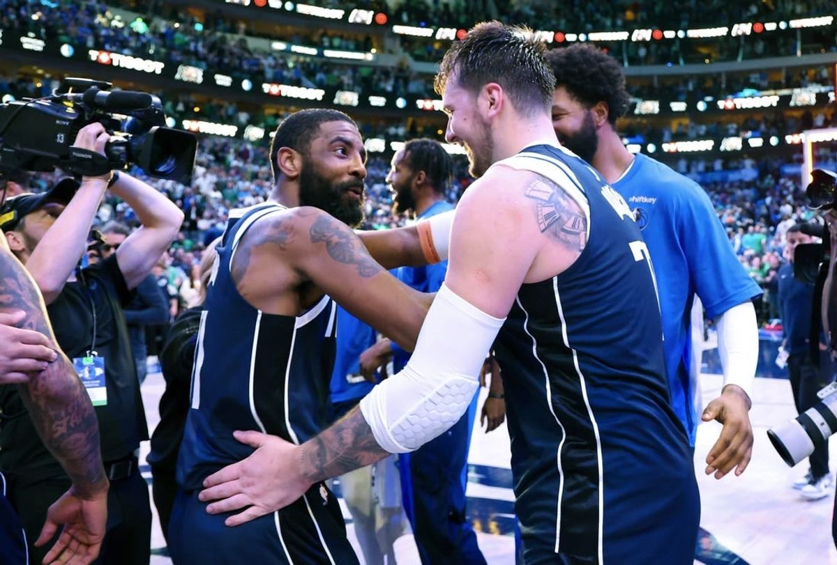 Mar 17, 2024; Dallas, Texas, USA;  Dallas Mavericks guard Kyrie Irving (11) celebrates with Dallas Mavericks guard Luka Doncic (77) after the win against the Denver Nuggets at American Airlines Center.