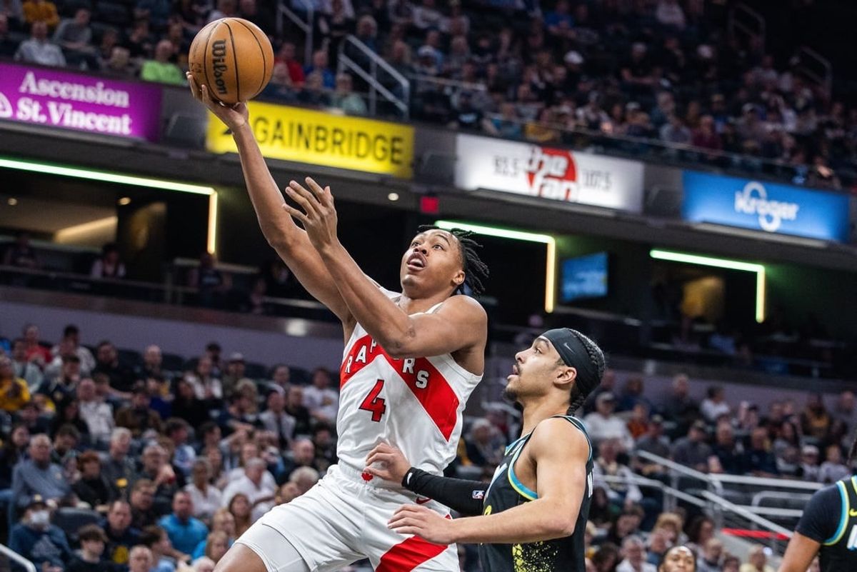 Feb 26, 2024; Indianapolis, Indiana, USA; Toronto Raptors forward Scottie Barnes (4) shoots the ball while Indiana Pacers guard Andrew Nembhard (2) defends in the first half at Gainbridge Fieldhouse.