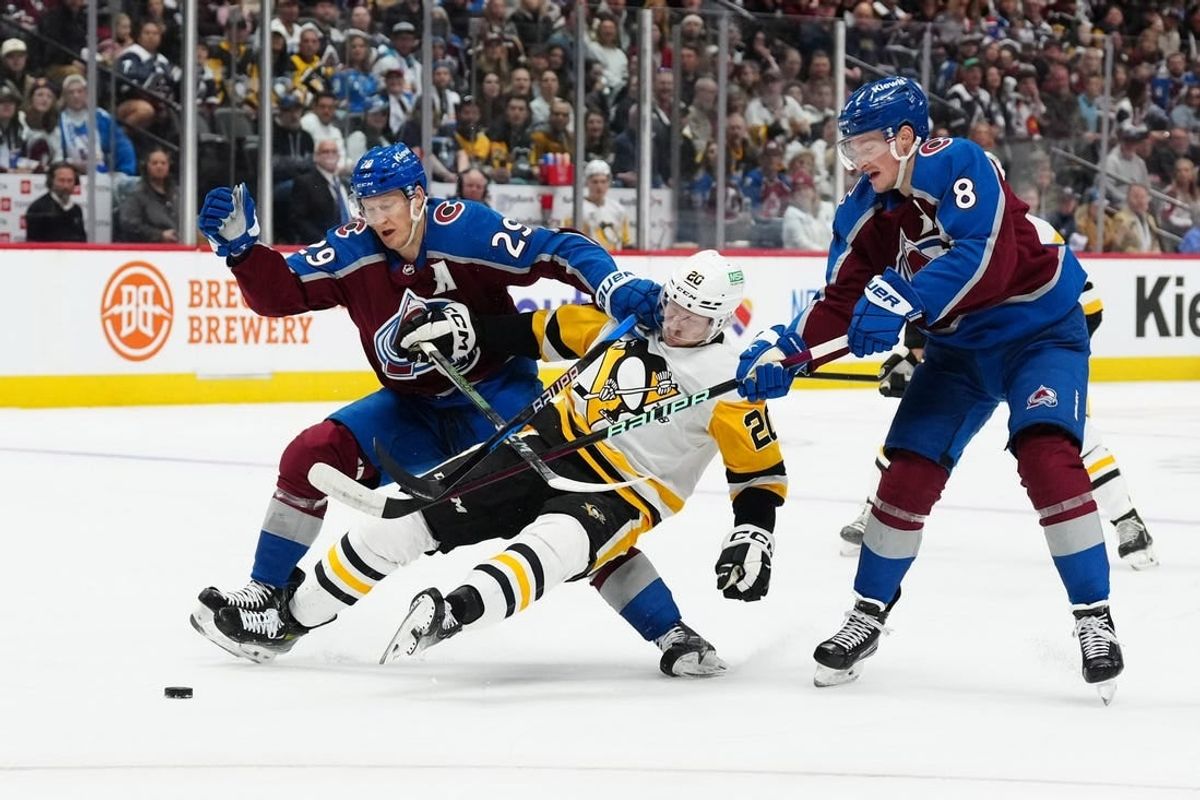 Mar 24, 2024; Denver, Colorado, USA; Colorado Avalanche center Nathan MacKinnon (29) and Colorado Avalanche defenseman Cale Makar (8) defend on Pittsburgh Penguins center Lars Eller (20) in the first period at Ball Arena.