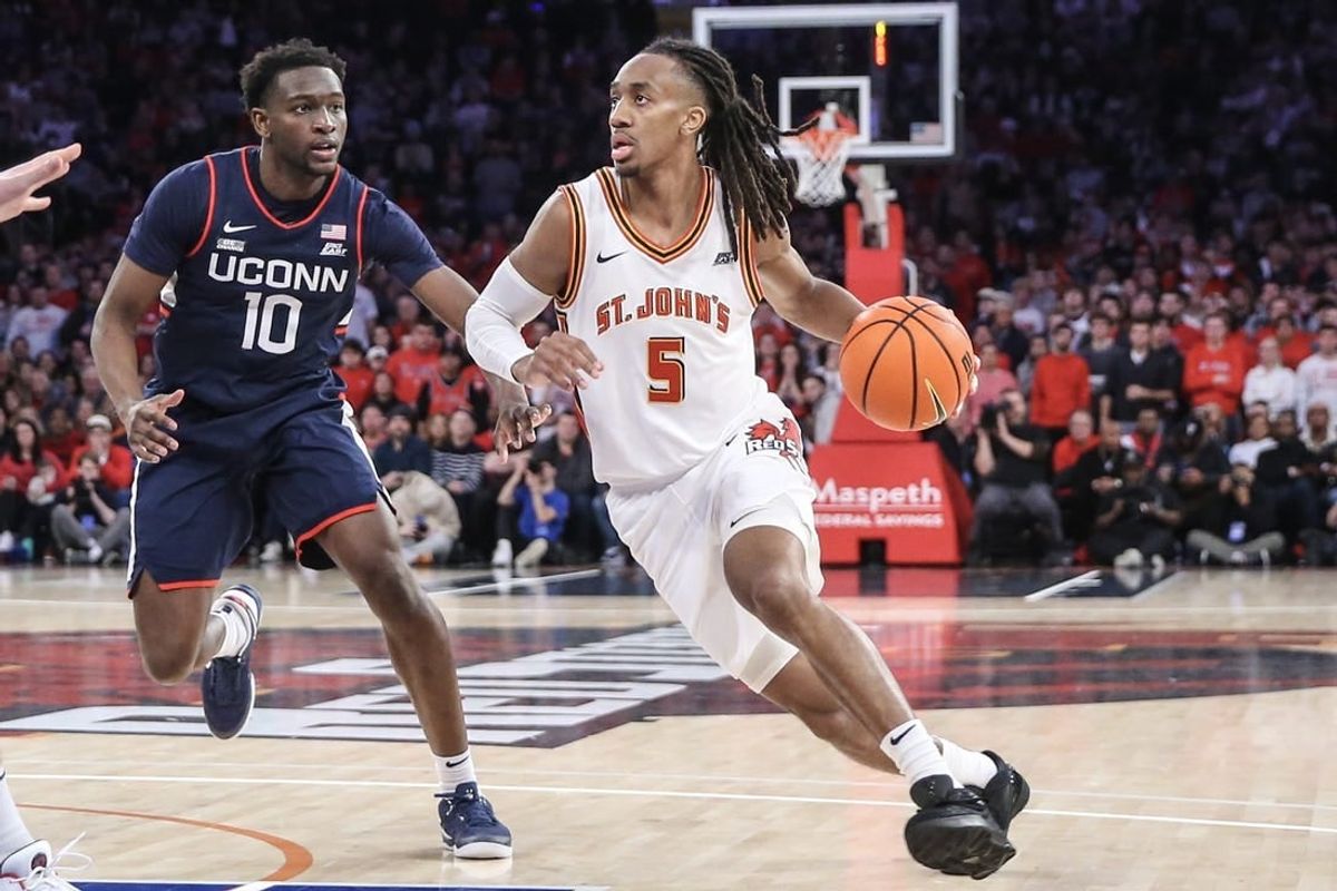 Feb 3, 2024; New York, New York, USA;  St. John's Red Storm guard Daniss Jenkins (5) drives past Connecticut Huskies guard Hassan Diarra (10) in the second half at Madison Square Garden.