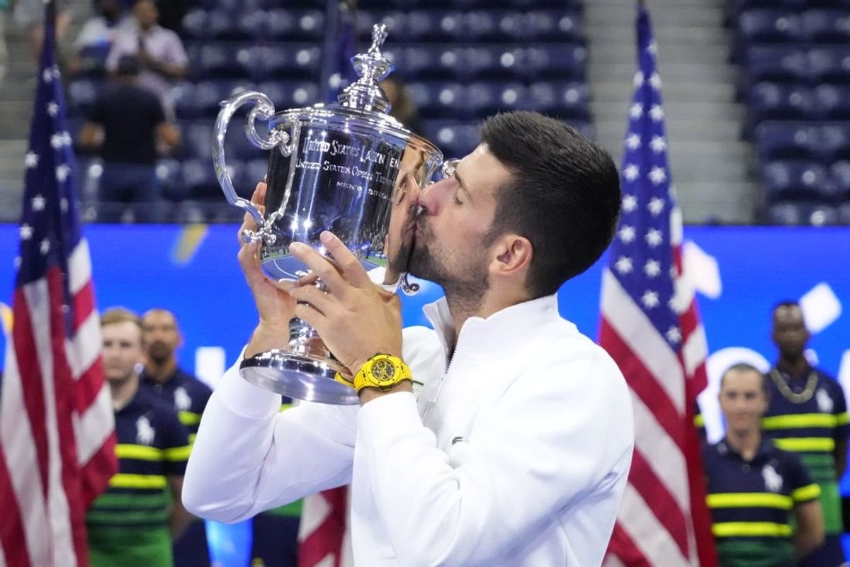 Sep 10, 2023; Flushing, NY, USA; Novak Djokovic of Serbia celebrates with the championship trophy after his match against Daniil Medvedev (not pictured) in the men's singles final on day fourteen of the 2023 U.S. Open tennis tournament at USTA Billie Jean King National Tennis Center.