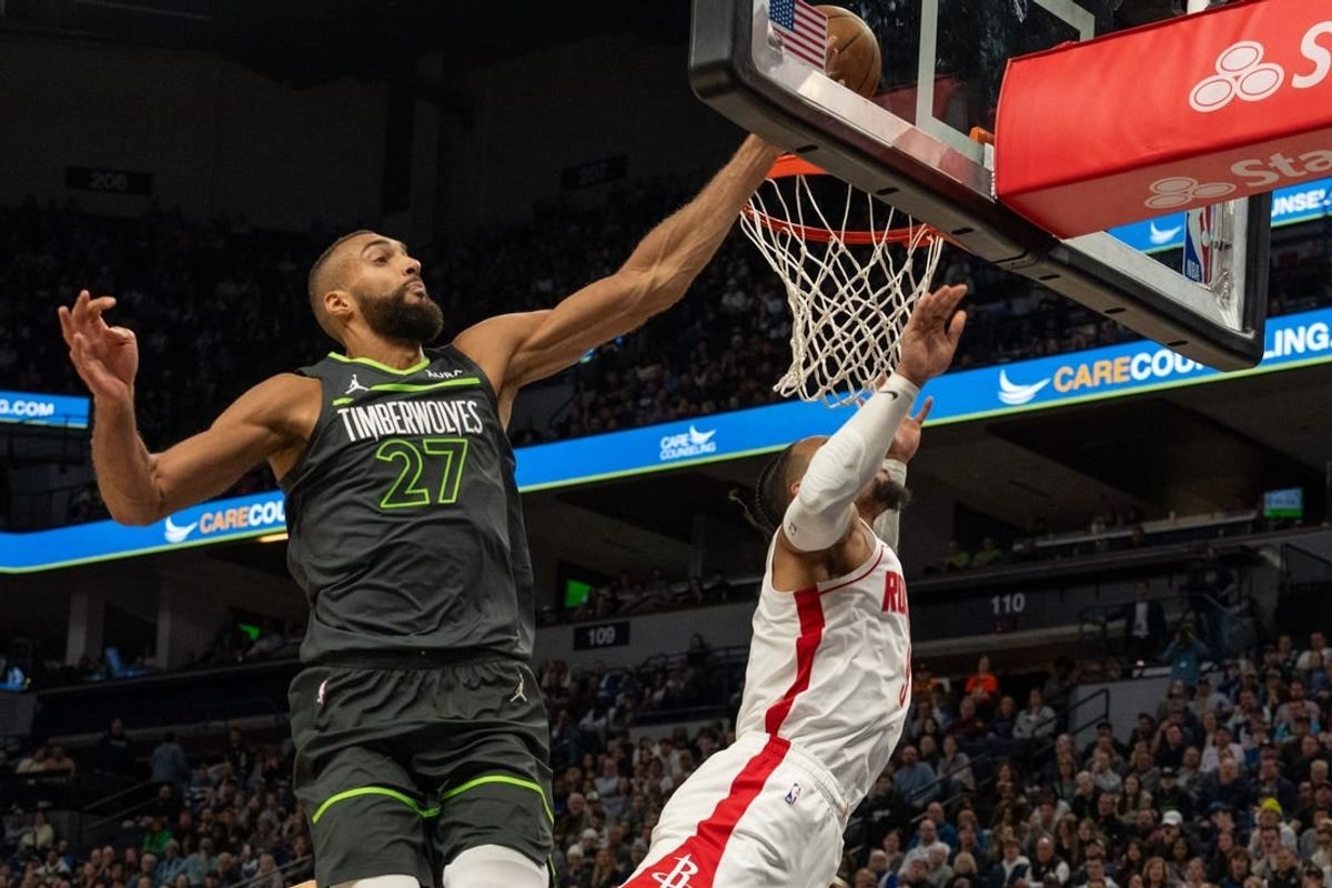 Apr 2, 2024; Minneapolis, Minnesota, USA; Minnesota Timberwolves center Rudy Gobert (27) blocks a shot by Houston Rockets forward Dillon Brooks (9) in the fourth quarter at Target Center.