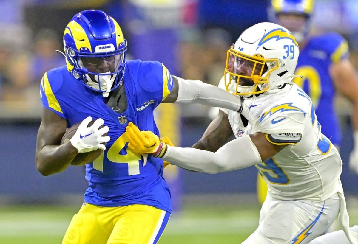 Aug 12, 2023; Inglewood, California, USA;   Los Angeles Rams wide receiver Tyler Johnson (14) is stopped by Los Angeles Chargers cornerback Michael Jacquet (39) after a first down in the second half at SoFi Stadium.