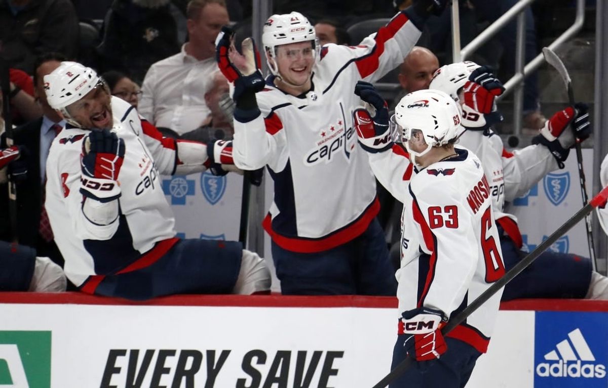 Mar 7, 2024; Pittsburgh, Pennsylvania, USA; Washington Capitals left wing Ivan Miroshnichenko (63) celebrates his first career NHL goal with the Capitals bench against the Pittsburgh Penguins during the second period at PPG Paints Arena.