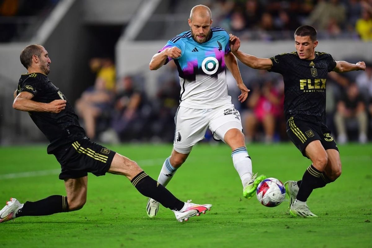 Oct 4, 2023; Los Angeles, California, USA; Los Angeles FC defender Sergi Palencia (30) and defender Giorgio Chiellini (14) play for the ball against Minnesota United forward Teemu Pukki (22) during the first half at BMO Stadium.