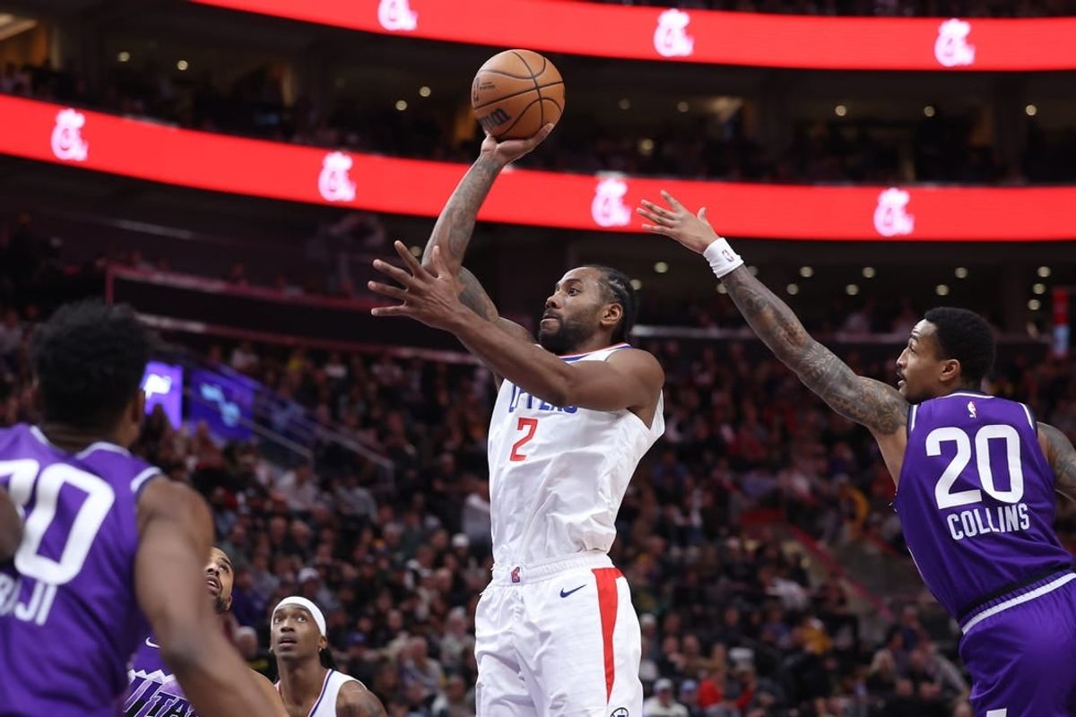 Dec 8, 2023; Salt Lake City, Utah, USA; Los Angeles Clippers forward Kawhi Leonard (2) shoots the ball past Utah Jazz forward John Collins (20) during the third quarter at Delta Center.