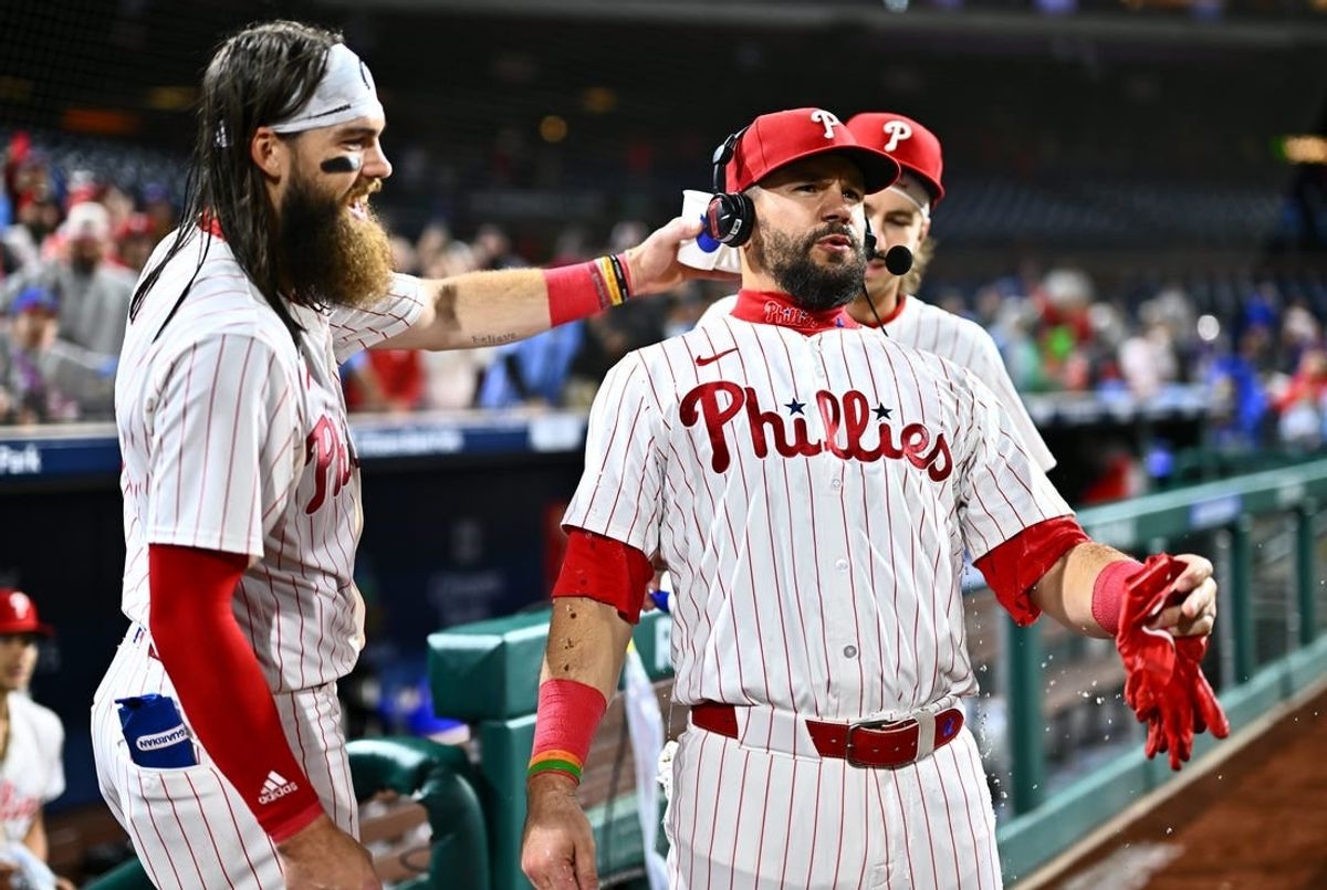 Apr 17, 2024; Philadelphia, Pennsylvania, USA; Philadelphia Phillies designated hitter Kyle Schwarber (12) reacts after being showered by outfielder Brandon Marsh (16) and second baseman Bryson Stott (5) after a game against the Colorado Rockies at Citizens Bank Park.