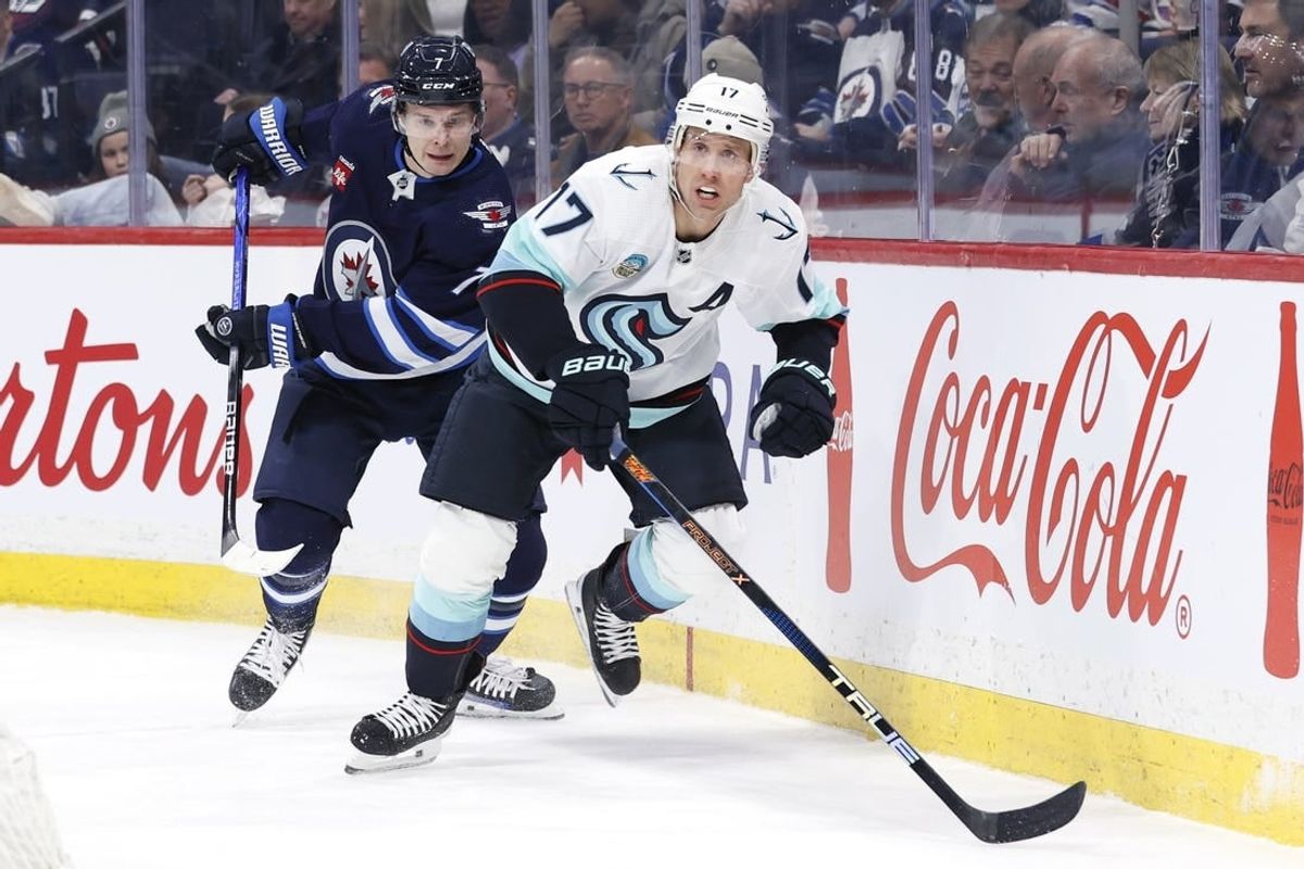 Mar 5, 2024; Winnipeg, Manitoba, CAN; Winnipeg Jets center Vladislav Namestnikov (7) and Seattle Kraken center Jaden Schwartz (17) chase after the puck in the first period at Canada Life Centre.