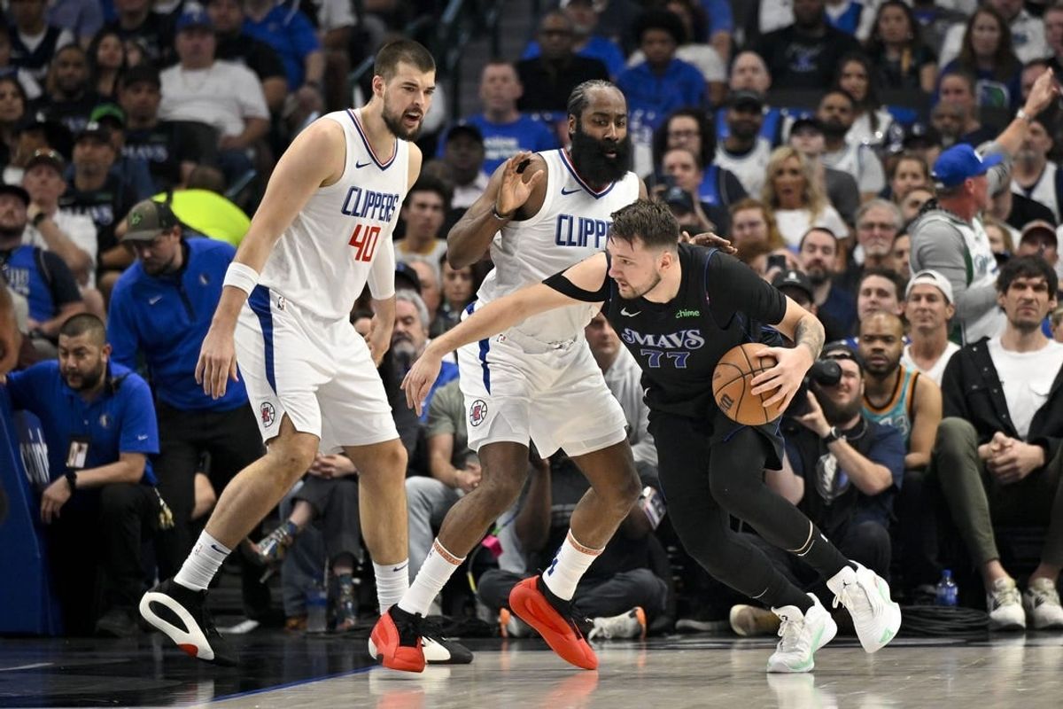 May 3, 2024; Dallas, Texas, USA; Dallas Mavericks guard Luka Doncic (77) looks to move the ball past LA Clippers guard James Harden (1) and center Ivica Zubac (40) during the first quarter during game six of the first round for the 2024 NBA playoffs at American Airlines Center.