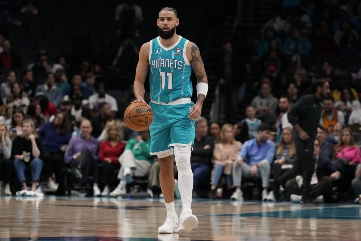 Jan 27, 2024; Charlotte, North Carolina, USA;  Charlotte Hornets forward Cody Martin (11) handles the ball against the Utah Jazz during the second quarter at Spectrum Center.
