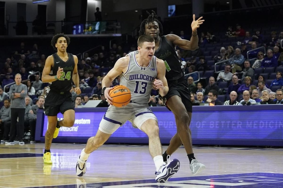 Dec 13, 2023; Evanston, Illinois, USA; Chicago State Cougars guard Wesley Cardet Jr. (1) defends Northwestern Wildcats guard Brooks Barnhizer (13) during the first half at Welsh-Ryan Arena.